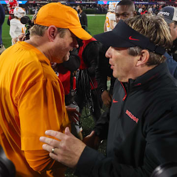 Nov 16, 2024; Athens, Georgia, USA; Tennessee Volunteers head coach Josh Heupel talks to Georgia Bulldogs head coach Kirby Smart after a game at Sanford Stadium. Mandatory Credit: Brett Davis-Imagn Images