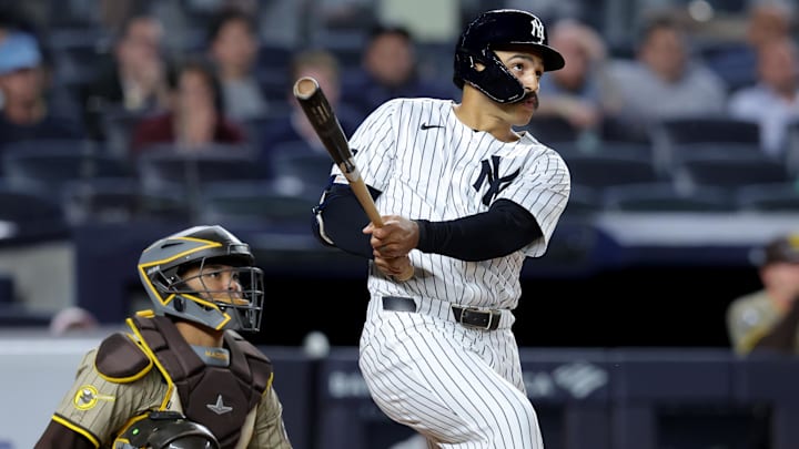 May 7, 2025; Bronx, New York, USA; New York Yankees pinch hitter Trent Grisham (12) follows through on a game tying two run home run against the San Diego Padres during the eighth inning at Yankee Stadium May 7, 2025; Bronx, New York, USA; New York Yankees pinch hitter Trent Grisham (12) follows through on a game tying two run home run against the San Diego Padres during the eighth inning at Yankee Stadium