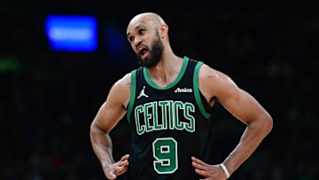 Apr 2, 2025; Boston, Massachusetts, USA; Boston Celtics guard Derrick White (9) has words with the official during the first half against the Miami Heat at TD Garden.