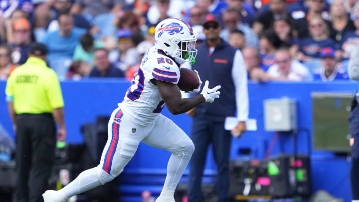 Aug 10, 2024; Orchard Park, New York, USA; Buffalo Bills running back Frank Gore Jr. (20) runs with the ball after making a catch against the Chicago Bears during the second half at Highmark Stadium. 