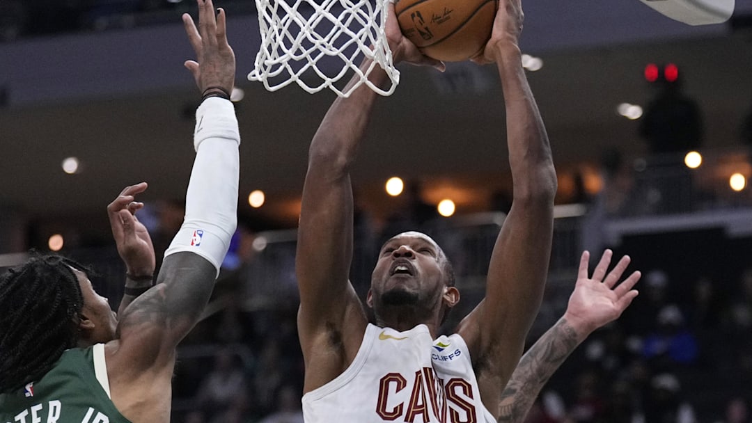 Mar 17, 2026; Milwaukee, Wisconsin, USA; Cleveland Cavaliers center Evan Mobley (4) shoots against Milwaukee Bucks guard/forward Kevin Porter Jr. (7), left, and Milwaukee Bucks forward Kyle Kuzma (18) in the first half at Fiserv Forum. Mandatory Credit: Michael McLoone-Imagn Images Mar 17, 2026; Milwaukee, Wisconsin, USA; Cleveland Cavaliers center Evan Mobley (4) shoots against Milwaukee Bucks guard/forward Kevin Porter Jr. (7), left, and Milwaukee Bucks forward Kyle Kuzma (18) in the first half at Fiserv Forum. Mandatory Credit: Michael McLoone-Imagn Images