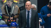 Vancouver Canucks head coach Rick Tocchet on the bench against the Colorado Avalanche.