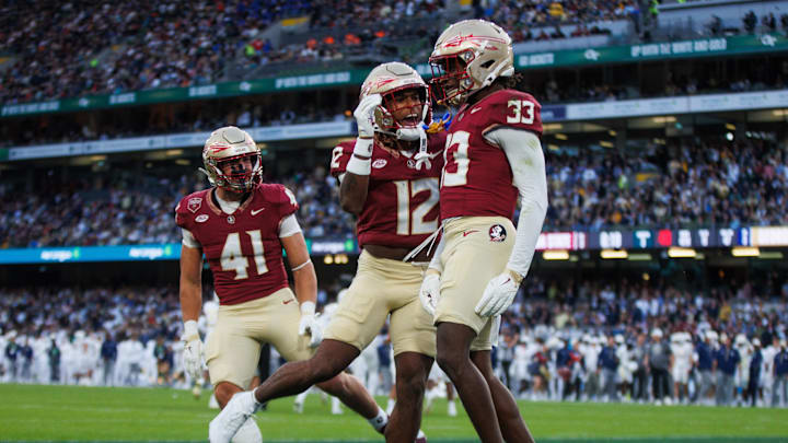 Aug 24, 2024; Dublin, IRL; Florida State University defensive back Edwin Joseph celebrates a tackle against Georgia Tech with defensive back Conrad Hussey at Aviva Stadium. Mandatory Credit: Tom Maher/INPHO via Imagn Images