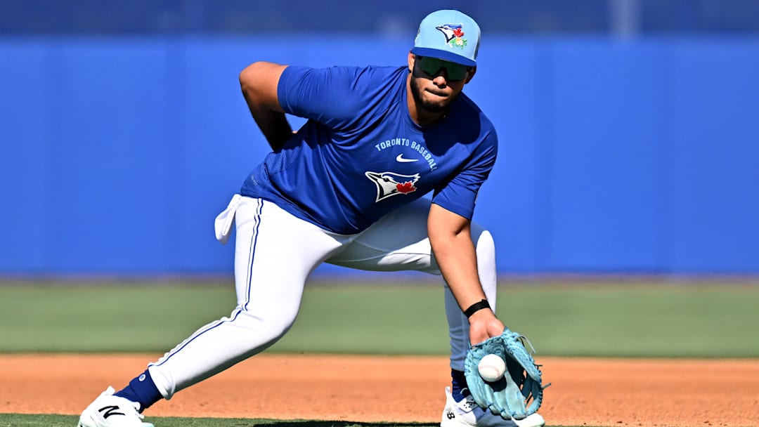 Feb 13, 2026; Dunedin, FL, USA; Toronto Blue Jays infielder Leo Jimenez (49) fields a ground ball during spring training at the Bobby Mattick Training Center at Englebert Complex. Mandatory Credit: Jonathan Dyer-Imagn Images