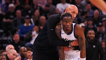 Mar 19, 2025; Sacramento, California, USA; Sacramento Kings interim head coach Doug Christie embraces guard Keon Ellis (23) between plays against the Cleveland Cavaliers during the fourth quarter at Golden 1 Center. Mandatory Credit: Kelley L Cox-Imagn Images