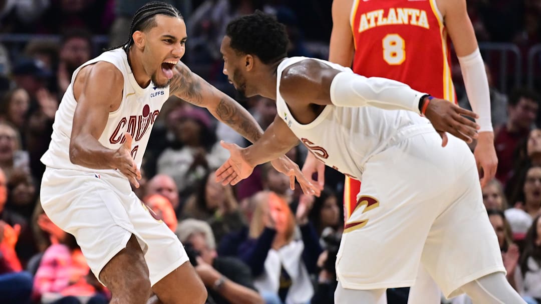 Nov 2, 2025; Cleveland, Ohio, USA; Cleveland Cavaliers guard Jaylon Tyson (20) celebrates with Cleveland Cavaliers guard Donovan Mitchell (45) during the first half against the Atlanta Hawks at Rocket Arena. Mandatory Credit: Ken Blaze-Imagn Images