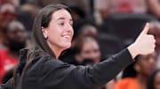 Indiana Fever's Caitlin Clark (22) gives a thumbs up to Los Angeles Sparks's Kelsey Plum (10) after she travels with the ball Saturday, July 19, 2025, during the WNBA All-Star Game at Gainbridge Fieldhouse in Indianapolis.