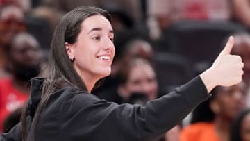 Indiana Fever's Caitlin Clark (22) gives a thumbs up to Los Angeles Sparks's Kelsey Plum (10) after she travels with the ball Saturday, July 19, 2025, during the WNBA All-Star Game at Gainbridge Fieldhouse in Indianapolis.