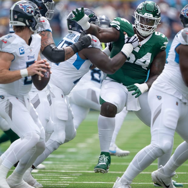 Tennessee Titans quarterback Will Levis is pressured by New York Jets defensive tackle Javon Kinlaw