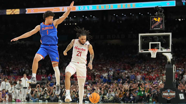 Houston guard Emanuel Sharp looks helpless after losing the ball as he attempts to shoot against Florida guard Walter Clayton Jr. in the final seconds of the national title game. Houston guard Emanuel Sharp looks helpless after losing the ball as he attempts to shoot against Florida guard Walter Clayton Jr. in the final seconds of the national title game.