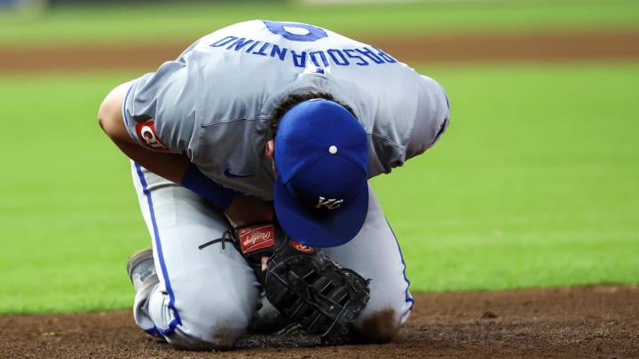 Aug 29, 2024; Houston, Texas, USA;  Kansas City Royals first baseman Vinnie Pasquantino (9) reacts after a collision with Houston Astros catcher Yainer Diaz (21) in the eighth inning at Minute Maid Park. Kansas City Royals first baseman Vinnie Pasquantino (9) had to leave the game.