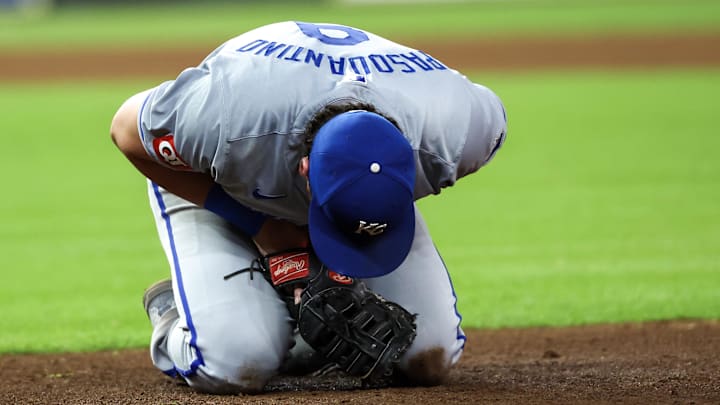 Aug 29, 2024; Houston, Texas, USA;  Kansas City Royals first baseman Vinnie Pasquantino (9 reacts after a collision with Houston Astros catcher Yainer Diaz (21) in the eighth inning at Minute Maid Park. Kansas City Royals first baseman Vinnie Pasquantino (9) had to leave the game .Mandatory Credit: Thomas Shea-Imagn Images