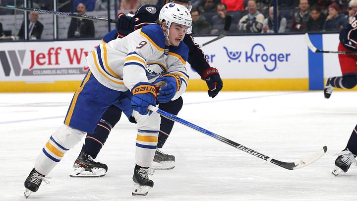 Oct 17, 2024; Columbus, Ohio, USA; Buffalo Sabres left wing  Zach Benson (9) reaches after a loose puck as Columbus Blue Jackets defenseman Jack Johnson (3) defends during the first period at Nationwide Arena. Mandatory Credit: Russell LaBounty-Imagn Images