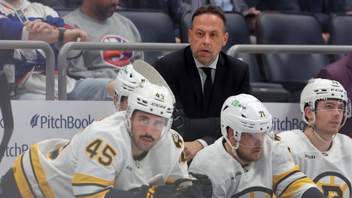 Nov 4, 2025; Elmont, New York, USA; Boston Bruins head coach Marco Sturm coaches against the New York Islanders during the second period at UBS Arena. Mandatory Credit: Brad Penner-Imagn Images