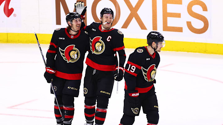 Apr 7, 2026; Ottawa, Ontario, CAN;  Ottawa Senators defenseman Jake Sanderson (85) celebrates scoring with left wing Brady Tkachuk (7) against the Tampa Bay Lightning during the third period at Canadian Tire Centre. 