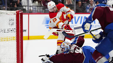 Mar 31, 2025; Denver, Colorado, USA; Calgary Flames right wing Adam Klapka (43) shoots the puck at Colorado Avalanche goaltender Scott Wedgewood (41) in the third period at Ball Arena. Mandatory Credit: Ron Chenoy-Imagn Images