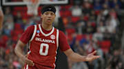 Mar 21, 2025; Raleigh, NC, USA;  Oklahoma Sooners guard Jeremiah Fears (0) reacts after scoring against Connecticut Huskies during the second half at Lenovo Center. Mandatory Credit: Zachary Taft-Imagn Images