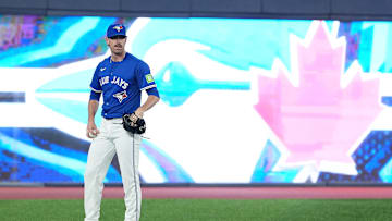 Aug 12, 2025; Toronto, Ontario, CAN; Toronto Blue Jays pitcher Shane Bieber (57) takes a break during batting practice before a game against the Chicago Cubs at Rogers Centre. Mandatory Credit: Nick Turchiaro-Imagn Images