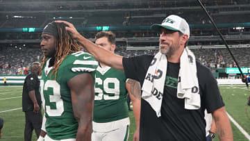 East Rutherford, NJ -- August 24, 2024 -- Takkarist McKinley of the Jets Aaron Rodgers at the end of the game. The New York Giants and New York Jets meet at MetLife Stadium in the final preseason game of the 2024 season for both teams.