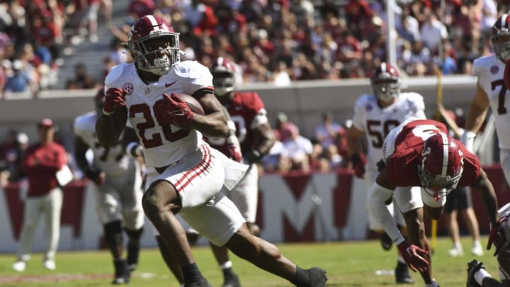 Apr 13, 2024; Tuscaloosa, AL, USA;  Alabama running back Jam Miller (26) breaks away from tacklers during the A-Day scrimmage at Bryant-Denny Stadium. Mandatory Credit: Gary Cosby Jr.-USA TODAY Sports