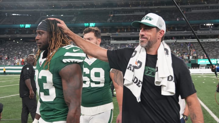 East Rutherford, NJ -- August 24, 2024 -- Takkarist McKinley of the Jets Aaron Rodgers at the end of the game. The New York Giants and New York Jets meet at MetLife Stadium in the final preseason game of the 2024 season for both teams.