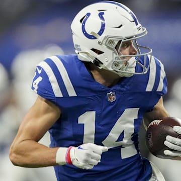 Dec 31, 2023; Indianapolis, Indiana, USA; Indianapolis Colts wide receiver Alec Pierce (14) looks back as he runs to the end zone for a touchdown during a game against the Las Vegas Raiders at Lucas Oil Stadium. Mandatory Credit: Bob Scheer-Imagn Images