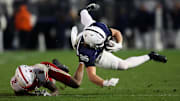 Penn State tight end Luke Reynolds is tackled by Nebraska wide receiver Jacory Barney Jr on a successful fake punt during the fourth quarter.