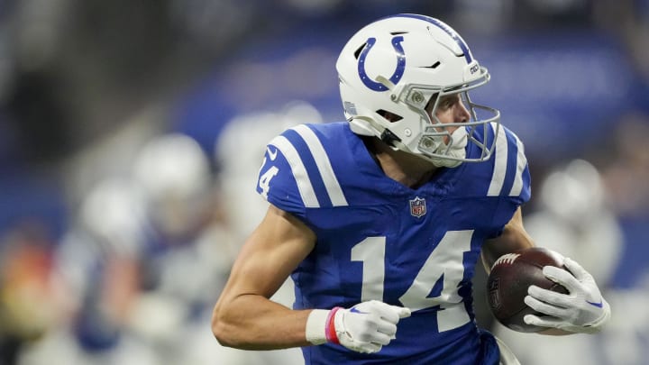 Dec 31, 2023; Indianapolis, Indiana, USA; Indianapolis Colts wide receiver Alec Pierce (14) looks back as he runs to the end zone for a touchdown during a game against the Las Vegas Raiders at Lucas Oil Stadium. Mandatory Credit: Bob Scheer-USA TODAY Sports