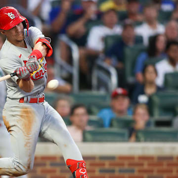 Sep 7, 2023; Atlanta, Georgia, USA; St. Louis Cardinals shortstop Tommy Edman (19) hits a two-run single against the Atlanta Braves in the second inning at Truist Park. Mandatory Credit: Brett Davis-Imagn Images