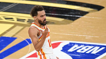 Atlanta Hawks guard Trae Young reacts during the third quarter against the Milwaukee Bucks in a semifinal of the 2024 Emirates NBA Cup at T-Mobile Arena