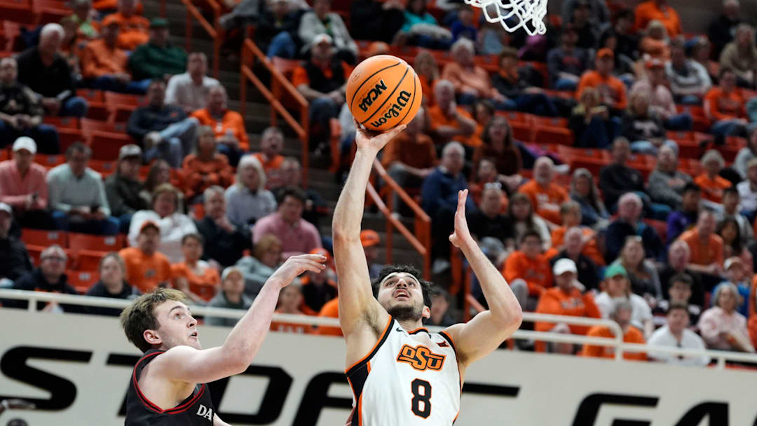 Oklahoma State Cowboys guard Daniel Guetta (8) puts up a shot beside Davidson Wildcats guard Nick Coval (3) during a first-round basketball game in the National Invitational between the Oklahoma State Cowboys and the Davidson Wildcats at Gallagher-Iba Arena in Stillwater, Okla., Tuesday, March 17, 2026. Oklahoma State Cowboys guard Daniel Guetta (8) puts up a shot beside Davidson Wildcats guard Nick Coval (3) during a first-round basketball game in the National Invitational between the Oklahoma State Cowboys and the Davidson Wildcats at Gallagher-Iba Arena in Stillwater, Okla., Tuesday, March 17, 2026.