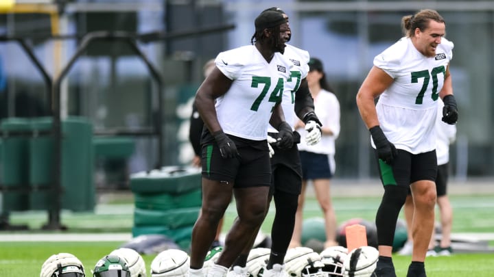 Jul 25, 2024; Florham Park, NJ, USA; New York Jets offensive tackle Olu Fashanu (74) warms up during training camp at Atlantic Health Jets Training Center. 