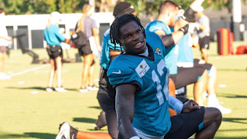 Jacksonville Jaguars wide receiver Travis Hunter stretches during an NFL training camp.