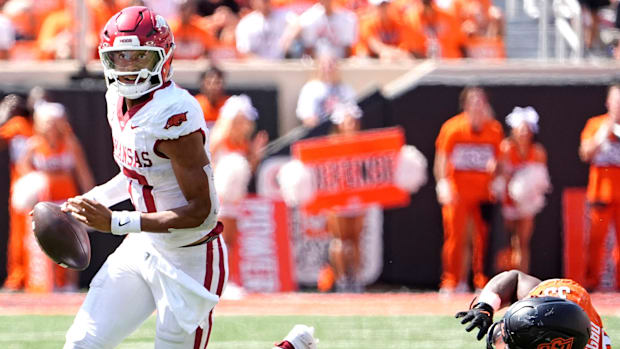 Arkansas' Taylen Green gets by Oklahoma State's Obi Ezeigbo in the first overtime