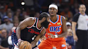 Nov 11, 2024; Oklahoma City, Oklahoma, USA; Oklahoma City Thunder guard Shai Gilgeous-Alexander (2) defends a drive by Los Angeles Clippers guard James Harden (1) during the second quarter at Paycom Center. Mandatory Credit: Alonzo Adams-Imagn Images