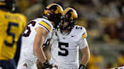 Sep 13, 2025; Berkeley, California, USA; Minnesota Golden Gophers quarterback Drake Lindsey (5) confers with tight end Jameson Geers (86) at the line of scrimmage during the fourth quarter against the California Golden Bears at California Memorial Stadium. Mandatory Credit: D. Ross Cameron-Imagn Images