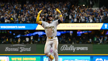 Oct 2, 2024; Milwaukee, Wisconsin, USA; Milwaukee Brewers outfielder Garrett Mitchell (5) celebrates after hitting a two-run home run during the eighth inning in game two of the Wildcard round for the 2024 MLB Playoffs against the New York Mets at American Family Field. Mandatory Credit: Benny Sieu-Imagn Images