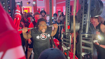 Wisconsin defensive lineman Charles Perkins prepares to squat over 600 pounds during the Badgers' Squat Fest event Friday at Camp Randall Stadium.
