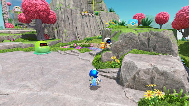 A bot clinging to a rock in Astro Bot's Sky Garden.