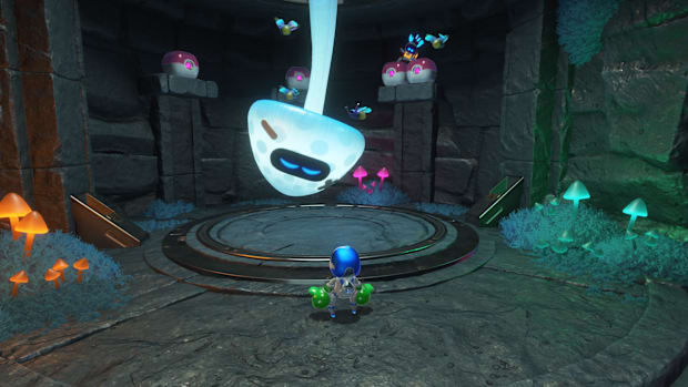 A bot in the Wormy Passage level of Astro Bot, behind a massive mushroom hanfing from the ceiling.