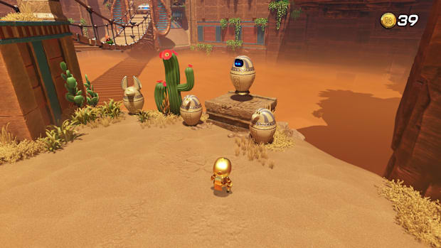 A bot inside a pot in the HIeroglitch Pyramid level of Astro Bot.