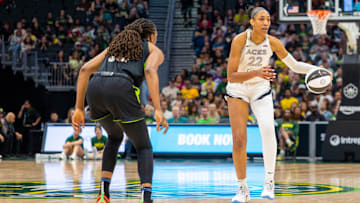 Jun 1, 2025; Seattle, Washington, USA;  Las Vegas Aces center A'ja Wilson (22) takes the ball down the court with Seattle Storm forward Nneka Ogwumike (3) on defense in the fourth period at Climate Pledge Arena. Mandatory Credit: Melissa Levin-Imagn Images