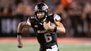 Sep 19, 2025; Stillwater, Oklahoma, USA; Oklahoma State Cowboys quarterback Zane Flores (6) runs the ball during the second half against the Tulsa Golden Hurricane at Boone Pickens Stadium. Mandatory Credit: William Purnell-Imagn Images