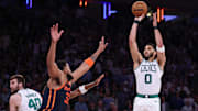 May 12, 2025; New York, New York, USA; Boston Celtics forward Jayson Tatum (0) shoots the ball as New York Knicks center Karl-Anthony Towns (32) defends in the second half during game four of the second round for the 2025 NBA Playoffs at Madison Square Garden. Mandatory Credit: Vincent Carchietta-Imagn Images