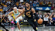 Donovan Mitchell, now engaged to Coco Jones, dribbles the ball during a playoff game against the Pacers.