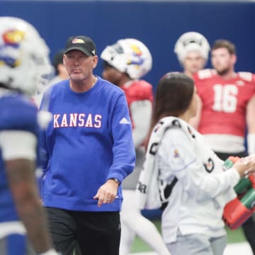 Kansas head coach Lance Leipold walks through the various teams during a team practice Tuesday, April 2, 2024, inside the Indoor Football Practice Facility.