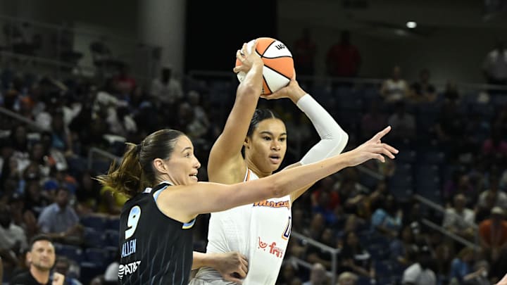 Jun 21, 2025; Chicago, Illinois, USA;  Phoenix Mercury forward Satou Sabally (0) passes the ball away fromChicago Sky guard Rebecca Allen (9) during the first half at Wintrust Arena. Mandatory Credit: Matt Marton-Imagn Images