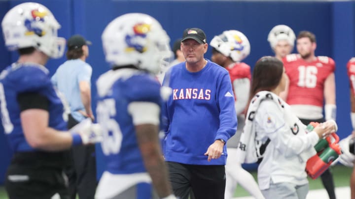 Kansas head coach Lance Leipold walks through the various teams during a team practice Tuesday, April 2, 2024, inside the Indoor Football Practice Facility.