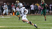 Hamilton Huskies runs with the ball against the Basha Bears during a game at Basha High School in Chandler on Oct. 24, 2025.
