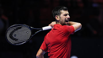 Novak Djokovic hits the ball